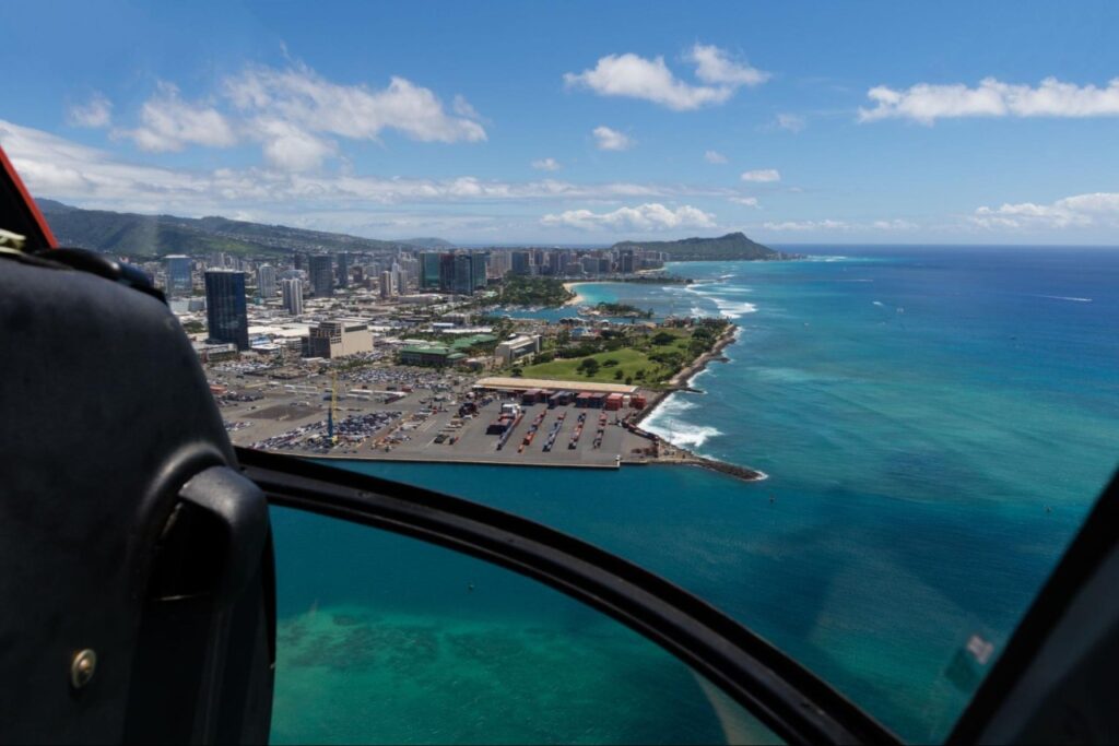 An aerial view of the island and sea from a helicopter